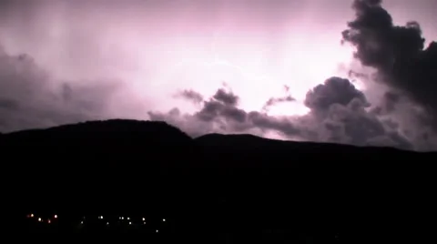 Timelapse lightning strikes over mountain Stock Footage 992028