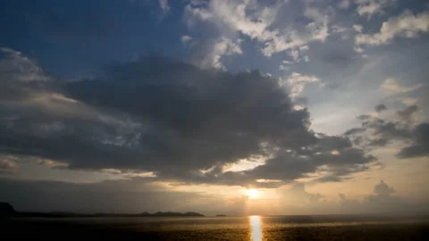 Timelapse looking over a lagoon  during sunset Stock Footage 148085781