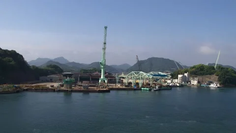 Timelapse, a lot of work at the shipyard, cranes in motion and passage of shi Stock Footage 197048841