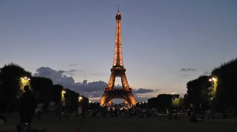Timelapse of love couples relaxing in front of famous Eiffel Tower, Paris Stock Footage 46805782