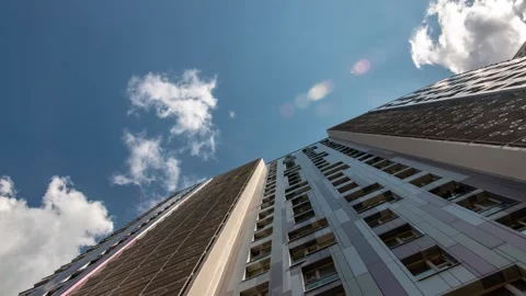 Timelapse of low angle view of city skyline buildings, blue sky and glass 스톡 동영상 274901420