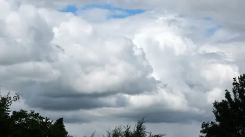 Timelapse of low developing cumulus and stratus clouds on a sunny day Stock Footage 136531316