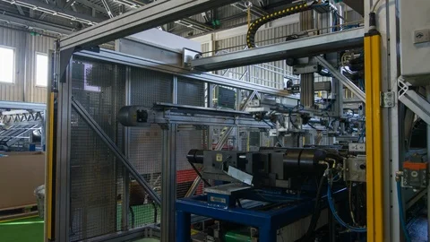 Timelapse machine with robotic arm removes metal sticks Stock Footage 103193339