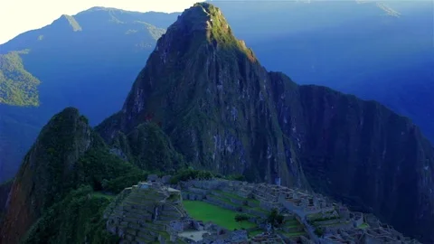 Timelapse of machupichu with the sun in the background down the mountain HD Video stock 75177650