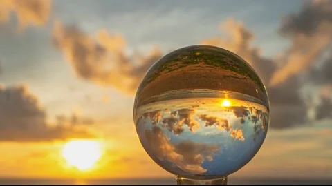 Timelapse magic sunset view of sunset in a crystal ball. Stock Footage 235156317