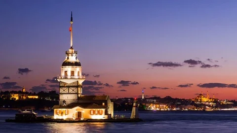 Timelapse of Maiden Tower or Kiz Kulesi with floating tourist boats on Bosphorus Stock Footage 80255092
