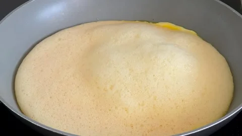 Timelapse of making a cheese omelet with fresh farm eggs, healthy homemade f Stock Footage 340044265