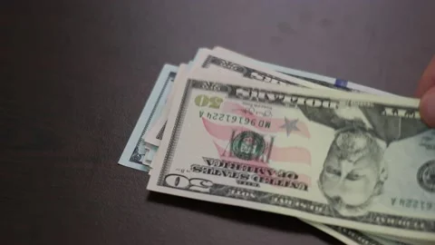 Timelapse of Man counts money. Stock Footage