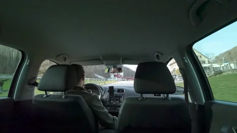 Timelapse man driving in car, shot from the backseat, concept of traveling Stock Footage 170814074
