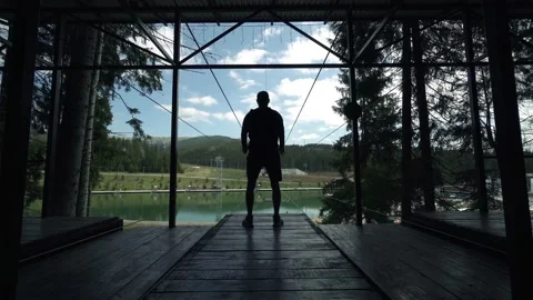 Timelapse of Man making exercises on a viewing mountains spot Stock Footage 199485871