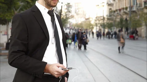 Timelapse of a man using a iphone downtown Stock Footage 34220818