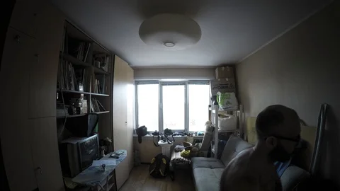 Timelapse of a man who does what in the room Stock-Footage 129574115