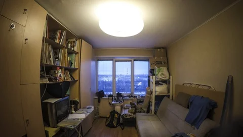 Timelapse of a man who does what in the room Stock-Footage 129574140