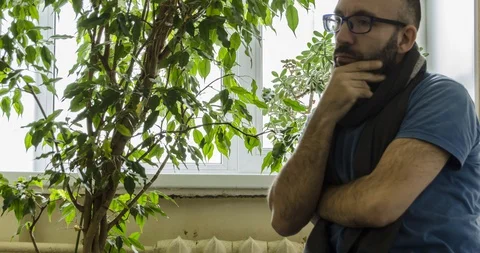 Timelapse of a man who thinks about something and argues with himself Stock-Footage 129574040