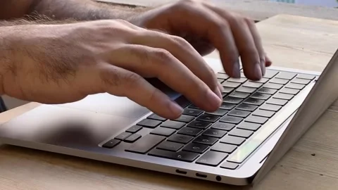 Timelapse of the man working and typing on a laptop at home. Stock Footage 249704743