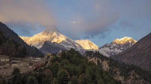 Timelapse of Manaslu mountain peak behind Tibetan monastery at Lho village Stock Footage 111762148