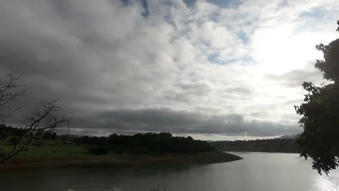 Timelapse With Many Clouds and Lake Stock Footage 133048747