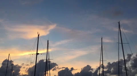 Timelapse: masts of sailing ships on a background of blue sky with clouds. Stock Footage 68789901