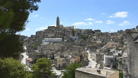Timelapse  of Matera under blue sky with moving clouds Stock Footage 93708314