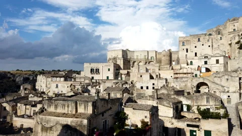 Timelapse Of Matera Under Blue Sky With Moving Clouds 動画素材 135411797