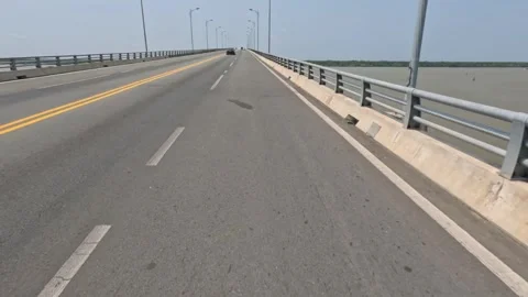Timelapse Mekong delta over the bridge. POV driving a motorbike Vietnam Stock Footage 243721186
