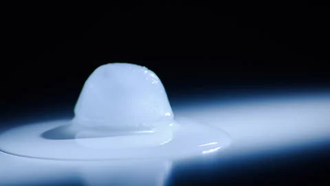 Timelapse of melting ice cube with dramatic lighting Stock Footage 250082232