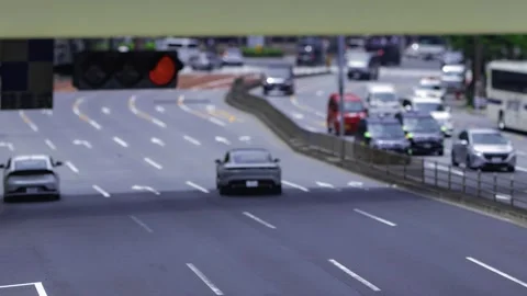 A timelapse of miniature traffic jam at the city crossing in Tokyo zoom Stock Footage 314242039