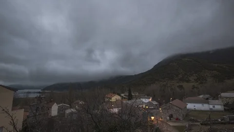 Timelapse of the mist moving at sunrise in a small mountain town in palencia, Stock Footage 125603241