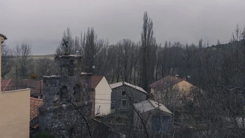 Timelapse of the mist moving at sunrise in a small mountain town in palencia, Stock Footage 125603245
