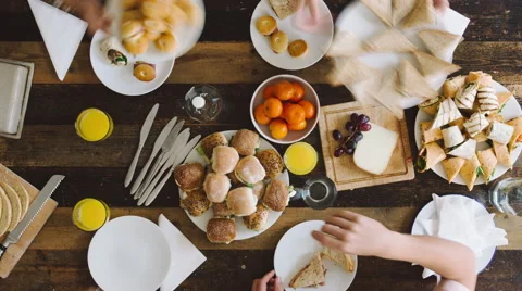Timelapse mixed group of people eating lunch aerial view organic food Stock Footage