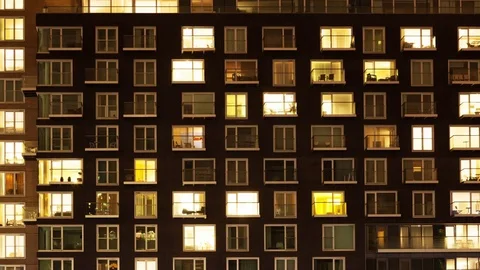 Timelapse of a modern apartment block at night  Stock Footage