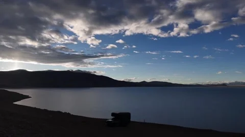 Timelapse Modern Camper Van Parked by Alpine Plateau Lake at Sunset Stock Footage 335003090