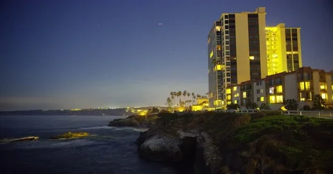 Timelapse of modern condominiums facing sunset and the beach at La Jolla, Stock Footage 81559508