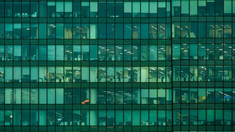 Timelapse. modern office building in the evening. windows Stock Footage 129848015