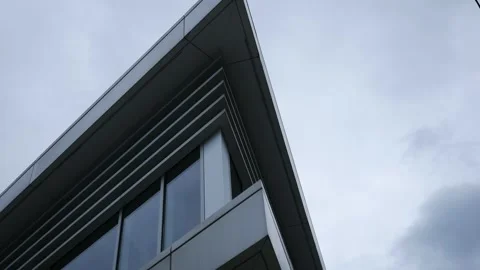 Timelapse of Modern  Office Building or Corporate Windows on Overcast Day Stock Footage 335663234