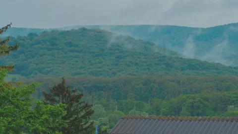 Timelapse, the moisture in the mountains rises up in the form of steam after rai Video stock 245229888