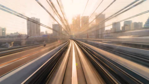 Timelapse of Monorail train leaving rainbow bridge into evening sunset golden Video stock 196476051