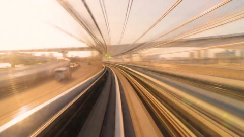 Timelapse of Monorail train making stop in Tokyo Metropolitan area in sunrise ho Stock Footage 196475987