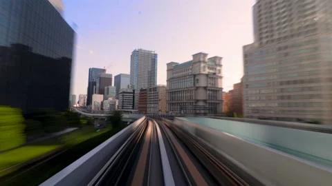 Timelapse of Monorail train making stop in Tokyo Metropolitan area in sunrise Stock-Footage 196476062