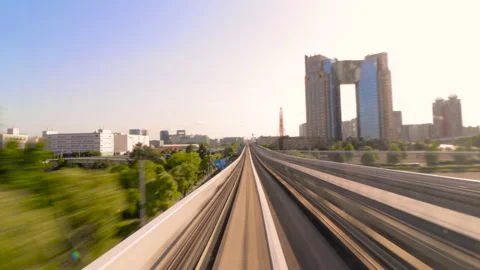 Timelapse of Monorail train travel between stop in Odaiba, Tokyo during sunrise. Stock-Footage 196476595