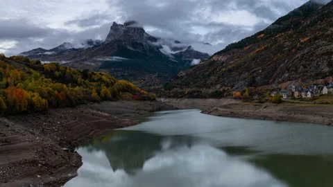 Timelapse of moody clouds and colourful autumnal forest in Lanuza, pyrenees  Stock Footage 164760994