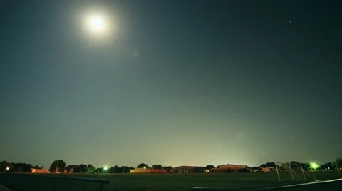 Timelapse of the Moon Crossing the Sky Over a Texas Football Field Stock Footage 11136008