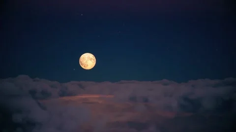 Timelapse of moon going up behind the clouds Stock Footage 160210115