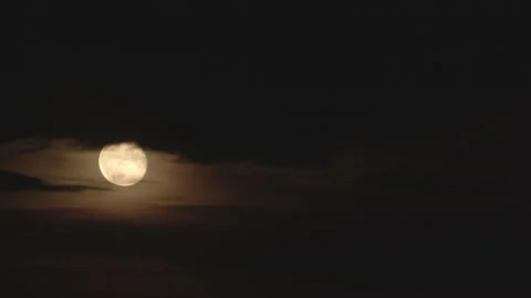 Timelapse of the Moon Hiding Behind Clouds Stock Footage 173760507