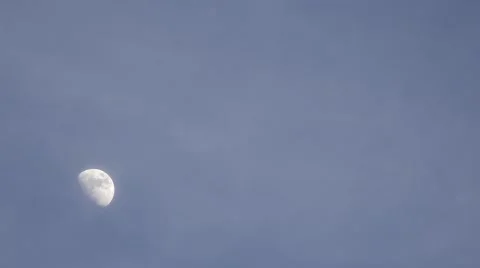 Timelapse of moon moving behind white clouds Stock Footage 59934810