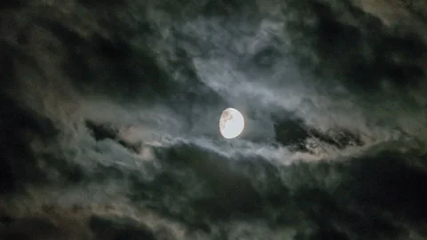 Timelapse with moon moving between clouds Stock Footage 96387284