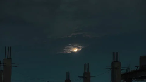 Timelapse of moon over concrete pillars building city sky Stock Footage 168898734
