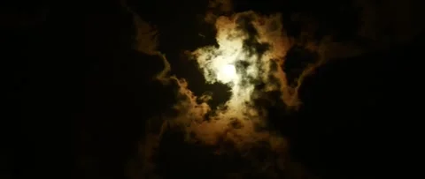 Timelapse of moon over dark dramatic clouds in night sky, anamorphic time lapse Stock Footage 194240297