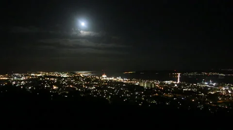 Timelapse of moon over Dundee cityscape at night Scotland Stock Footage 57472262