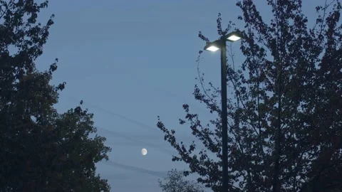 Timelapse of the Moon from a Parking Lot 動画素材 221587599